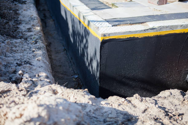 Professional Basement Waterproofing technician working in Vandiver, AL